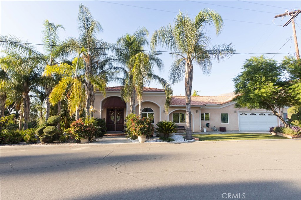 20026 Harvard Way Riverside, CA 92507 - Photo 1 of 1 a front view of a house with a garden