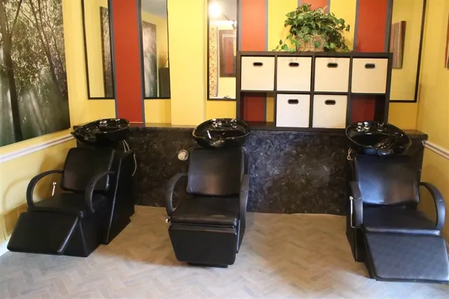 a living room with furniture and large windows