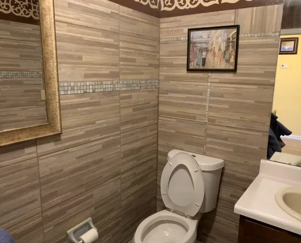 a bathroom with a toilet and a sink