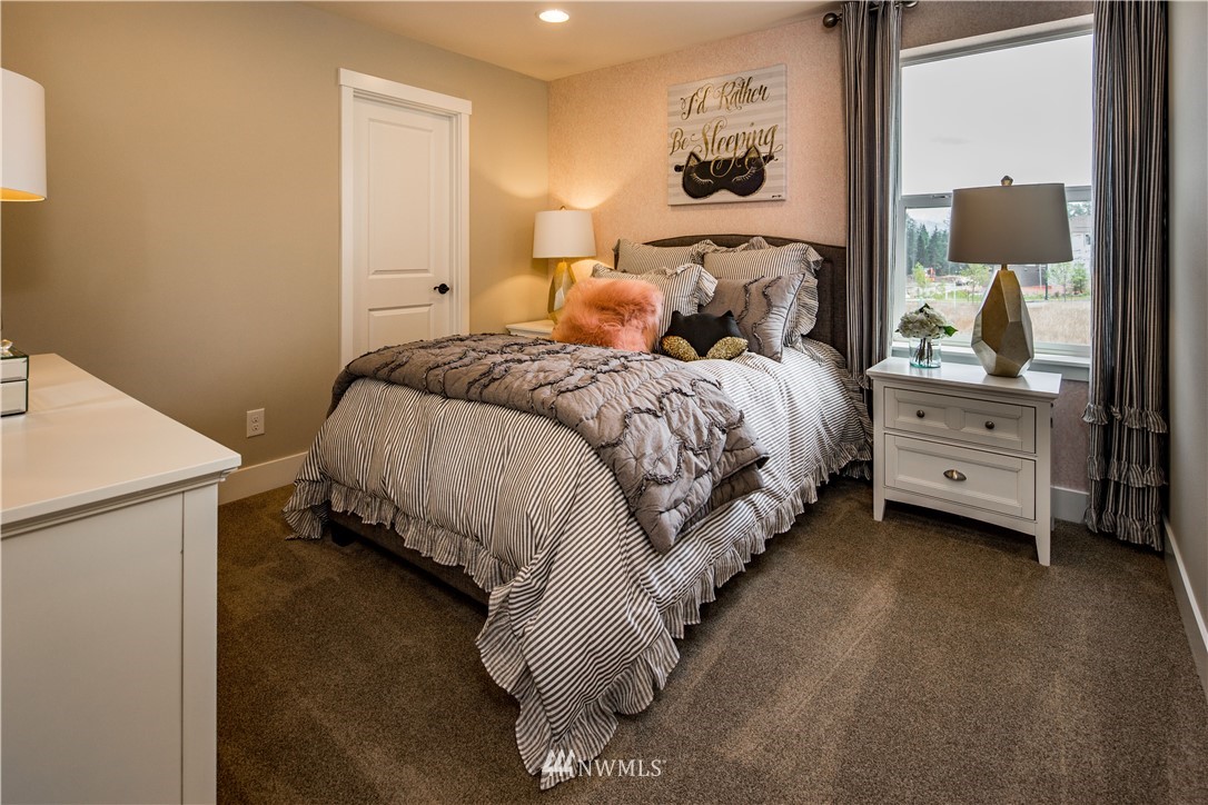 115 215th Street Southeast, Unit 6 Bothell, WA 98021 - Photo 14 of 18 a bed room with a bed and a night stand