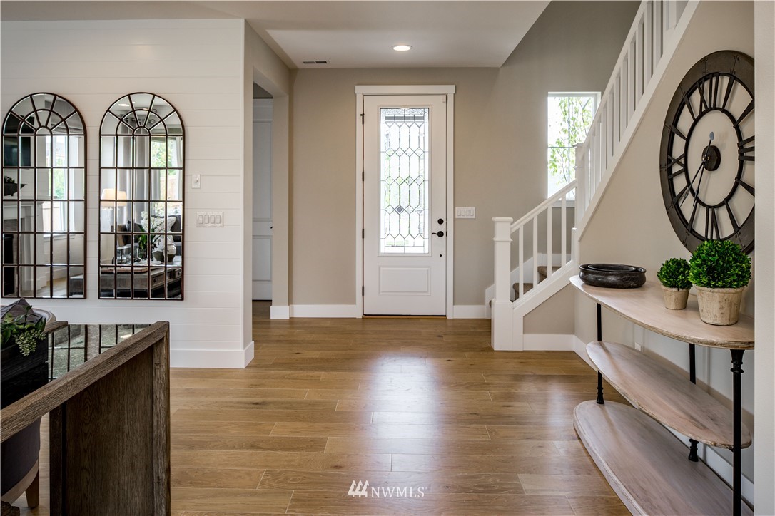 115 215th Street Southeast, Unit 6 Bothell, WA 98021 - Photo 6 of 18 a view of an entryway with wooden floor