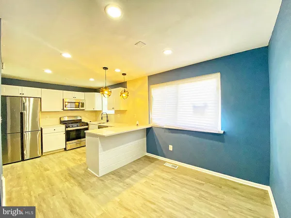 a large kitchen with a large window