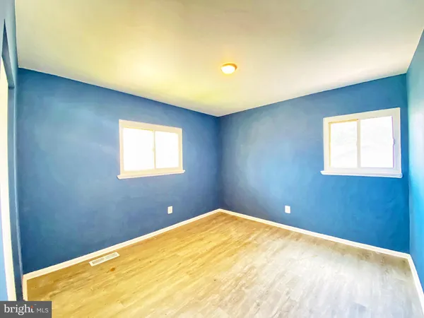 a view of a big room with windows