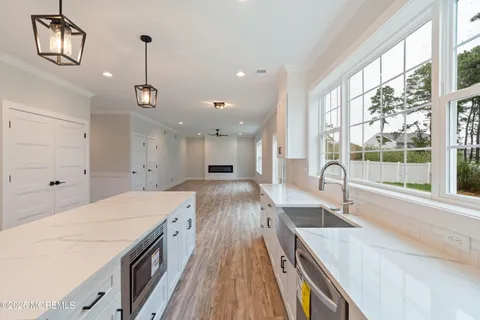 a kitchen with a stove and a refrigerator