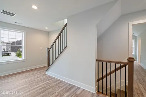 a bathroom with a double vanity sink mirror and bathtub