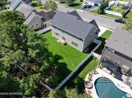 an aerial view of a house with a garden and plants