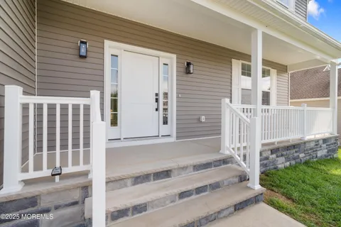 a view of wooden house with a large window