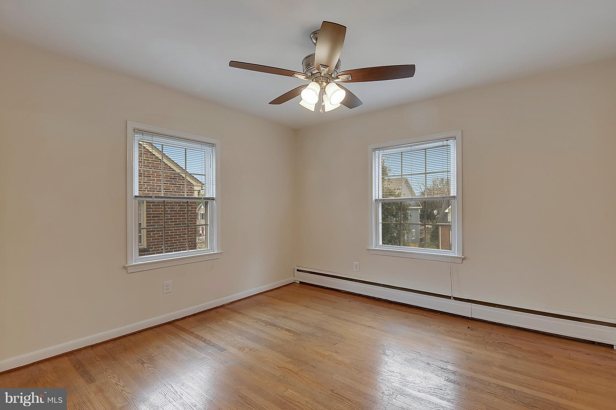 4023 18th Road North, Unit 1 Arlington, VA 22207 - Photo 12 of 30 a view of an empty room with wooden floor and a window