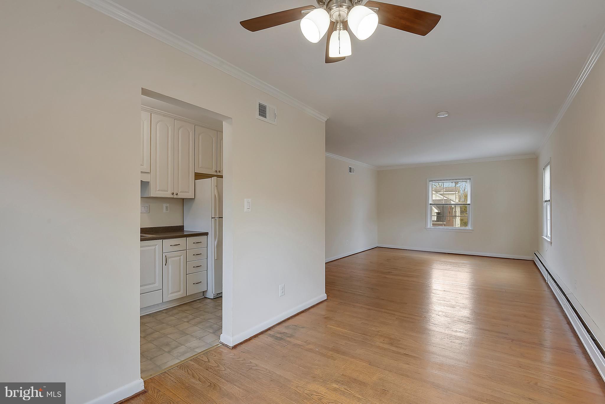 4023 18th Road North, Unit 1 Arlington, VA 22207 - Photo 5 of 30 wooden floor in an empty room with a window