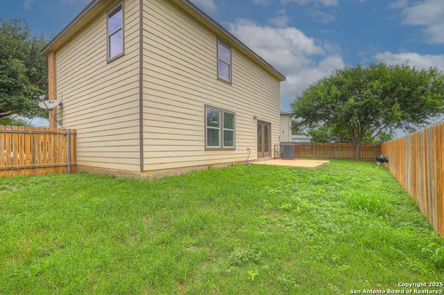 a backyard of a house with lots of green space