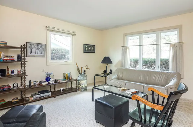 a bathroom with a tub a sink and mirror