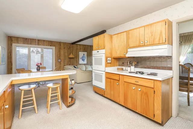a very nice looking kitchen with a large window