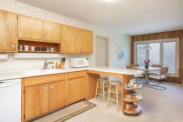 a living room with granite countertop furniture and a sink