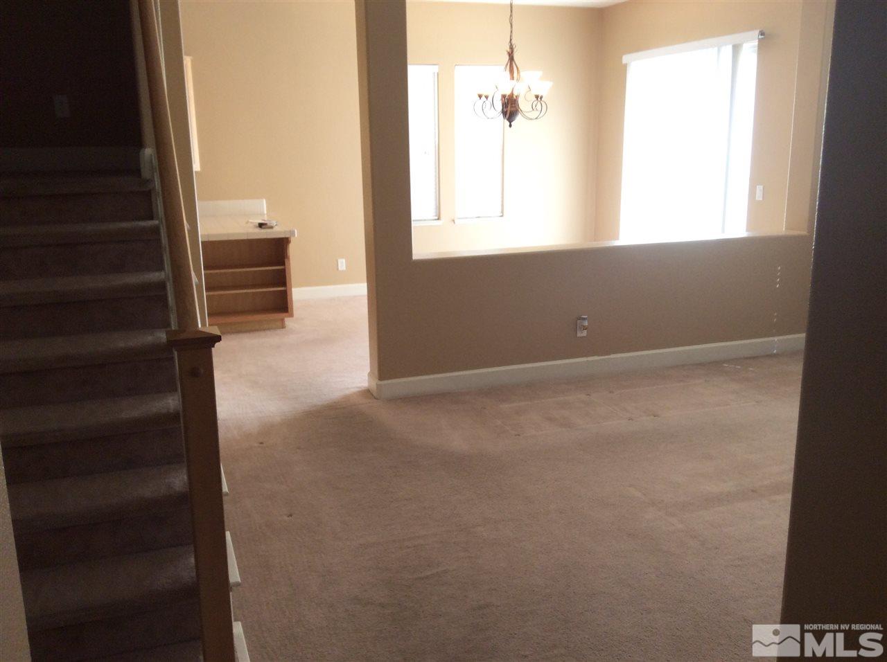 1660 Sawtooth Trail Reno, NV 89523 - Photo 13 of 18 an empty room with windows and closet