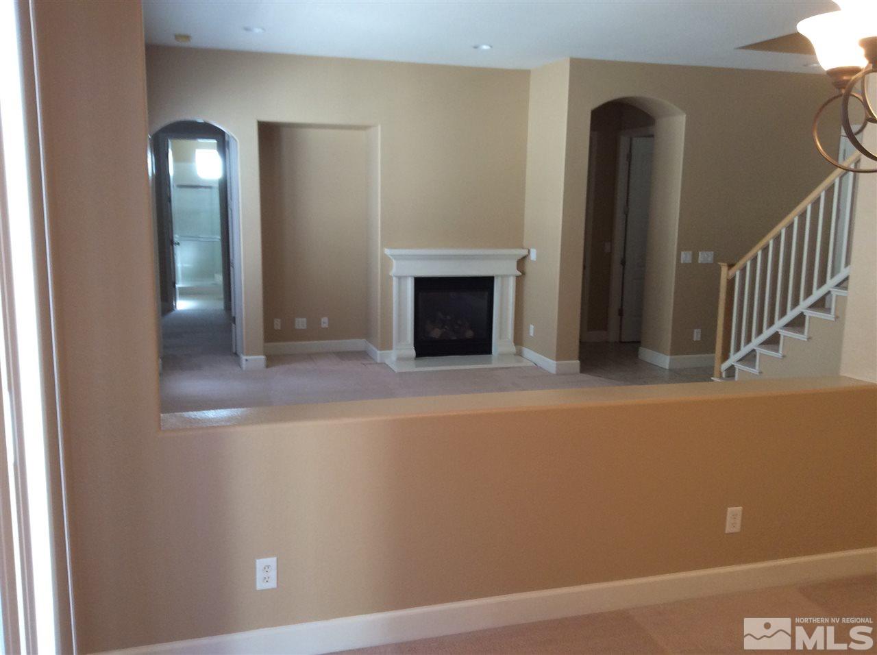 1660 Sawtooth Trail Reno, NV 89523 - Photo 15 of 18 a view of a livingroom with an empty space and a fireplace