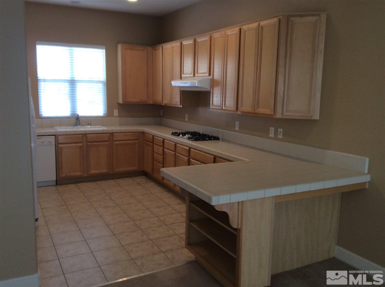 1660 Sawtooth Trail Reno, NV 89523 - Photo 3 of 18 a kitchen with a sink cabinets and window