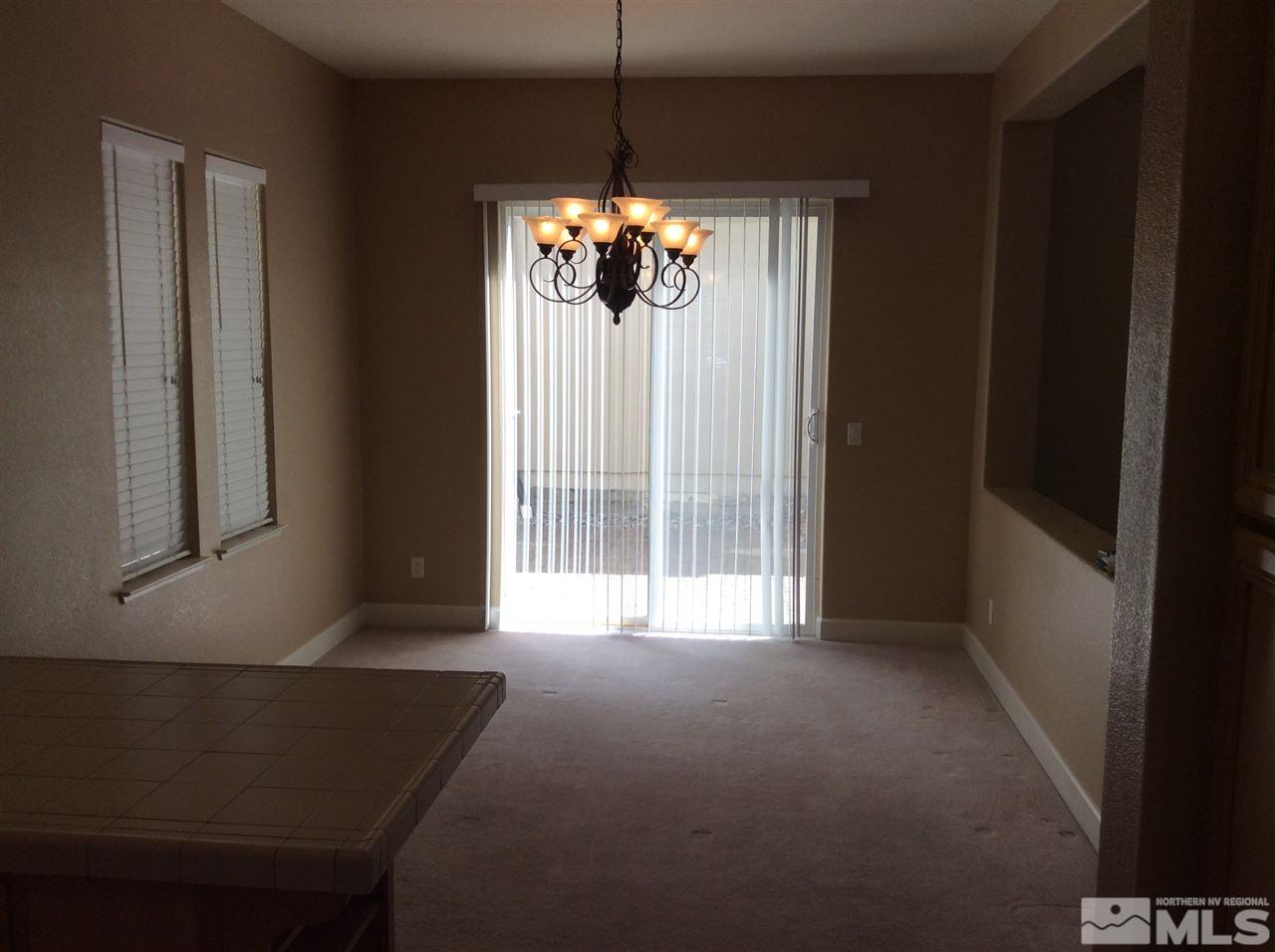 1660 Sawtooth Trail Reno, NV 89523 - Photo 4 of 18 a view of an empty room with a window