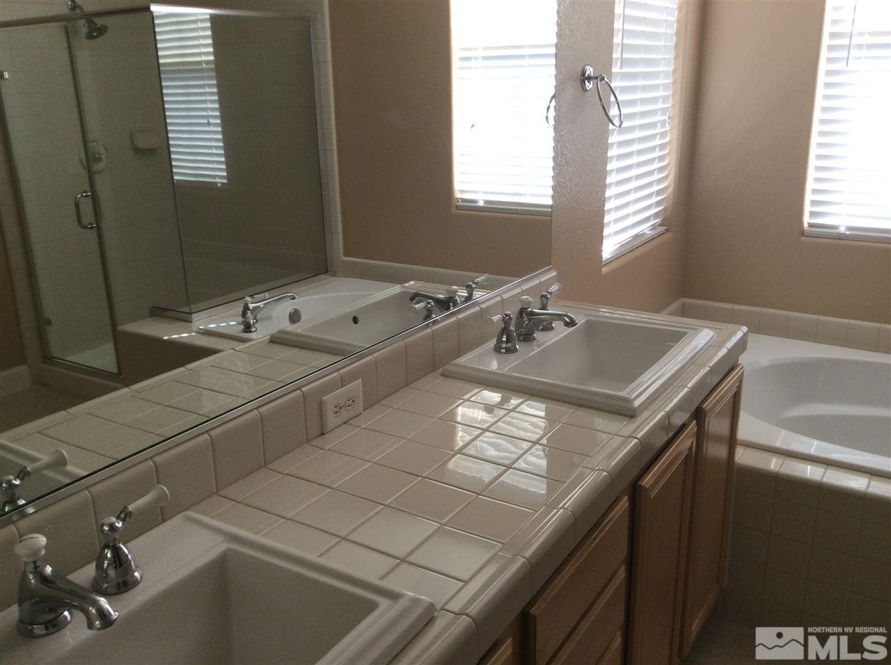 1660 Sawtooth Trail Reno, NV 89523 - Photo 8 of 18 a bathroom with a sink and a bathtub
