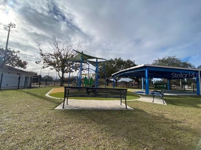 907 Columbia Street Orlando, FL 32805 - Photo 20 of 30 a view of a park with swings and slides