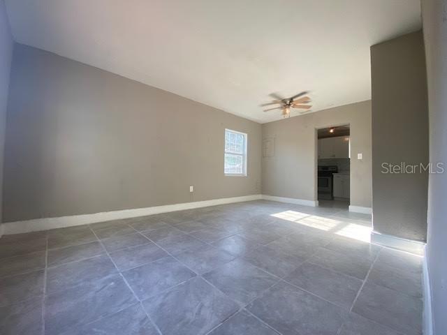907 Columbia Street Orlando, FL 32805 - Photo 10 of 30 en empty room with windows and entrance
