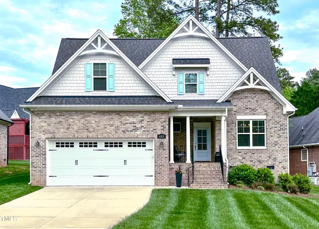 front view of a house with a yard