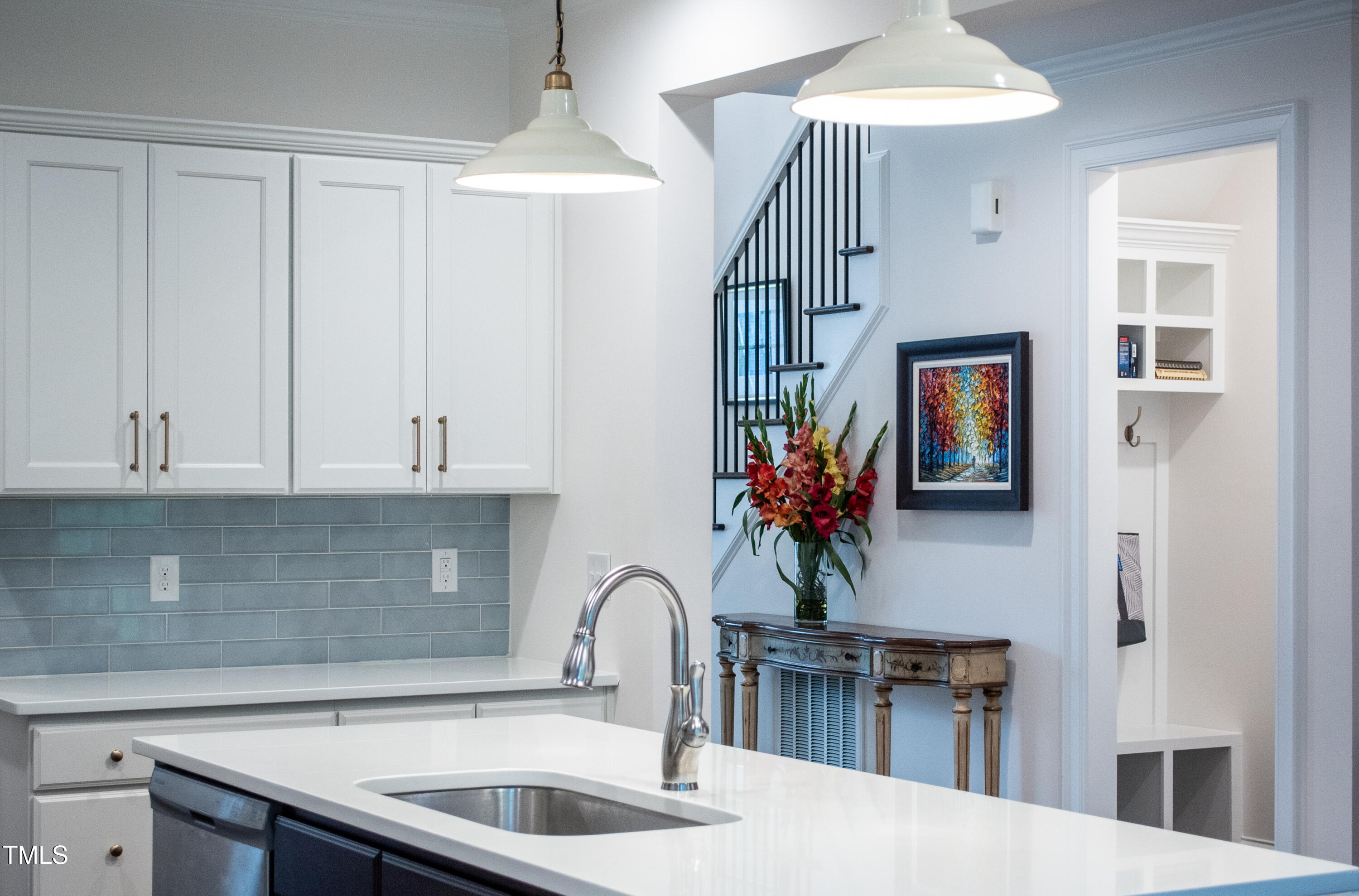 409 Eagle Court Henderson, NC 27536 - Photo 11 of 54 a kitchen with cabinets a sink and dishwasher