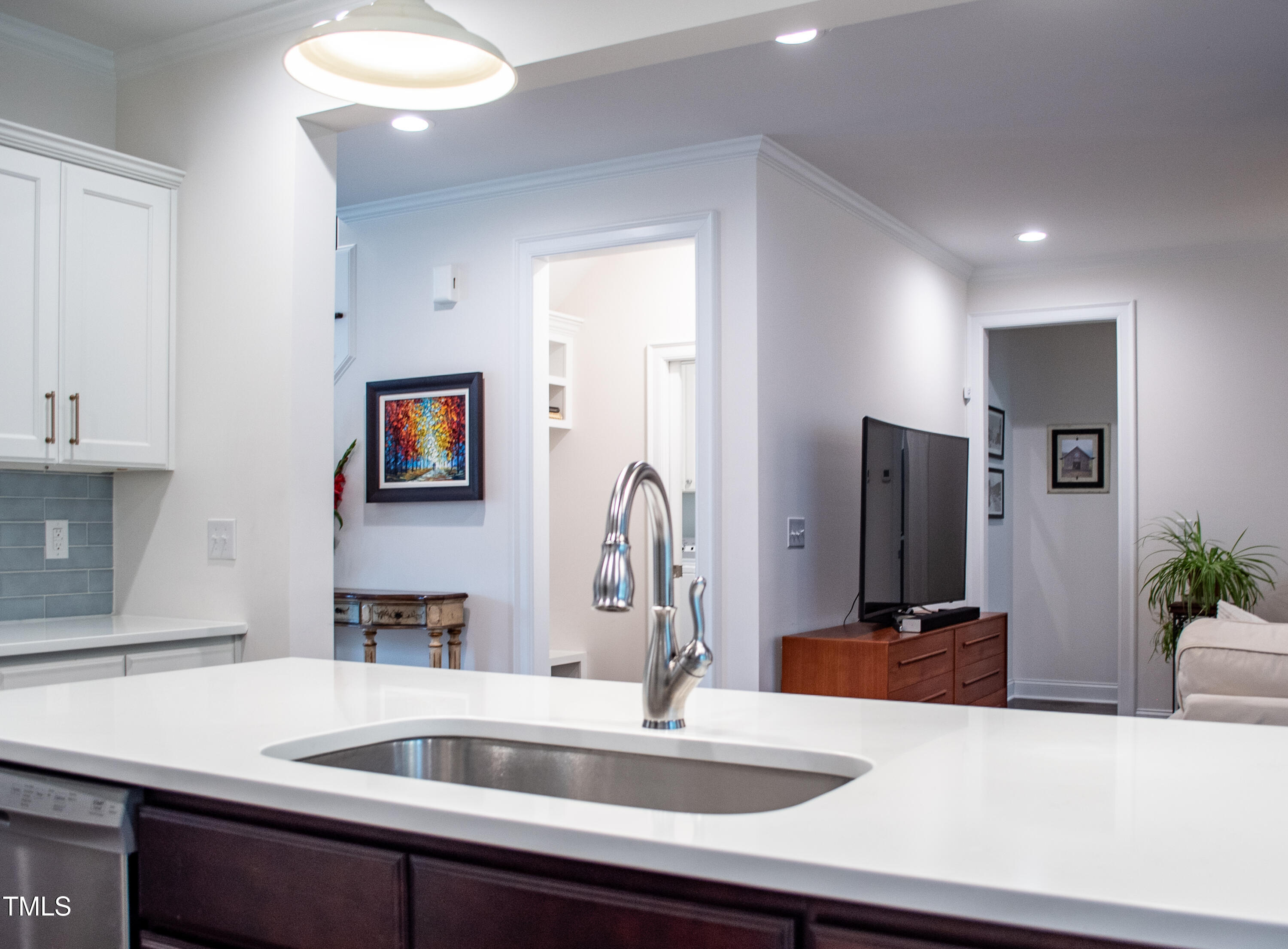 409 Eagle Court Henderson, NC 27536 - Photo 12 of 54 a kitchen with a sink and a refrigerator
