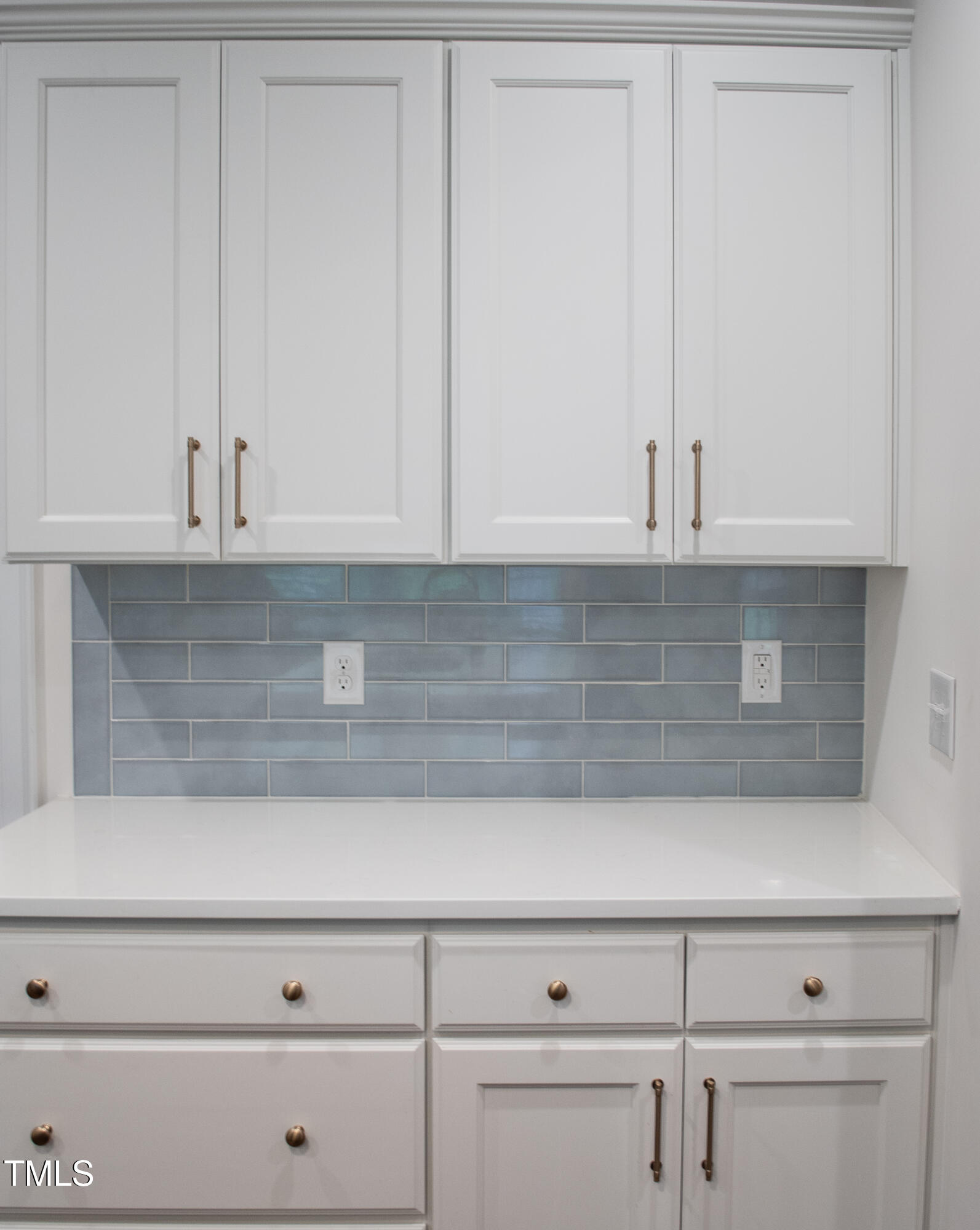 409 Eagle Court Henderson, NC 27536 - Photo 14 of 54 a view of white cabinets and a wooden floor