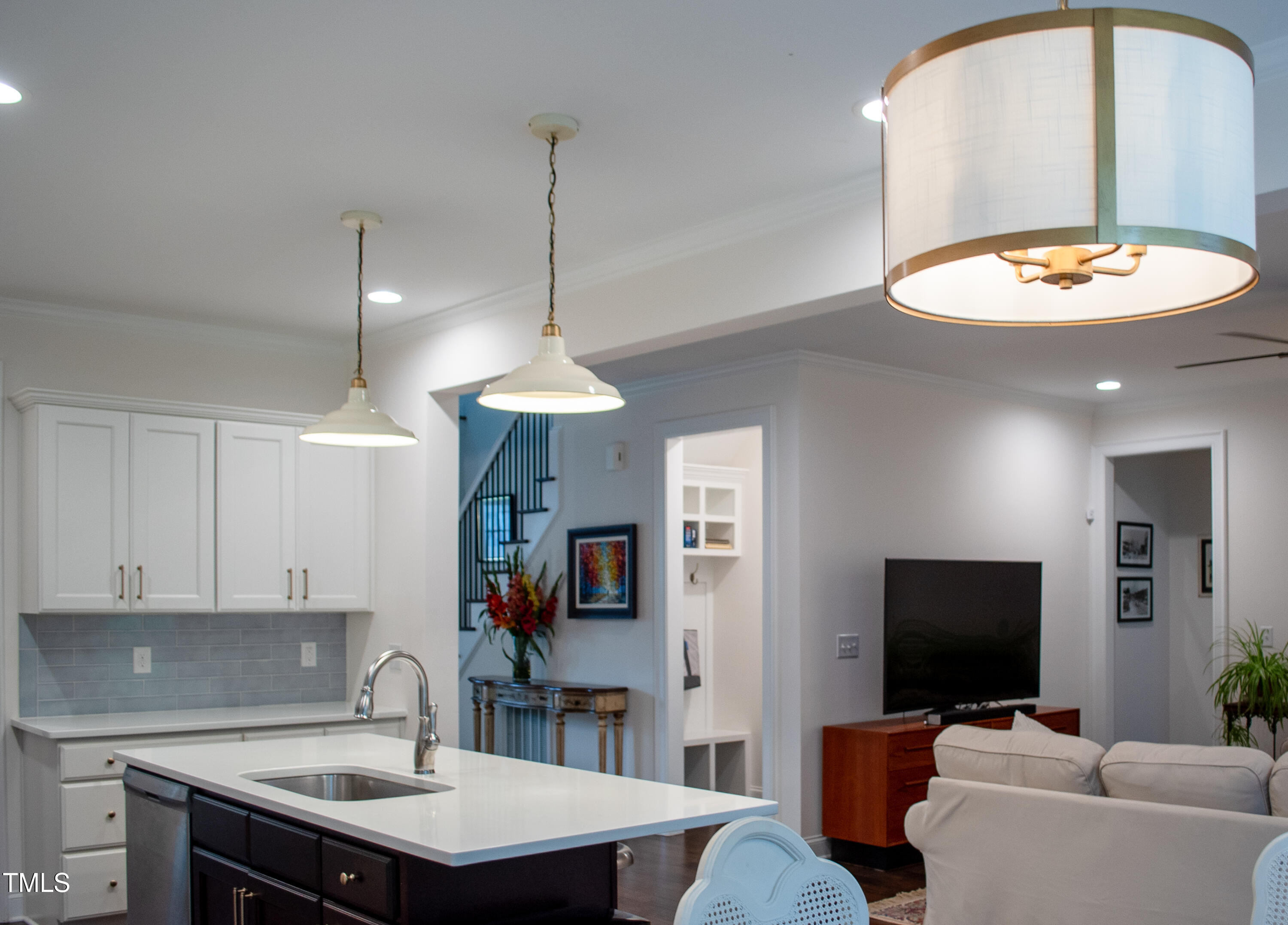 409 Eagle Court Henderson, NC 27536 - Photo 15 of 54 a living room with furniture and a flat screen tv