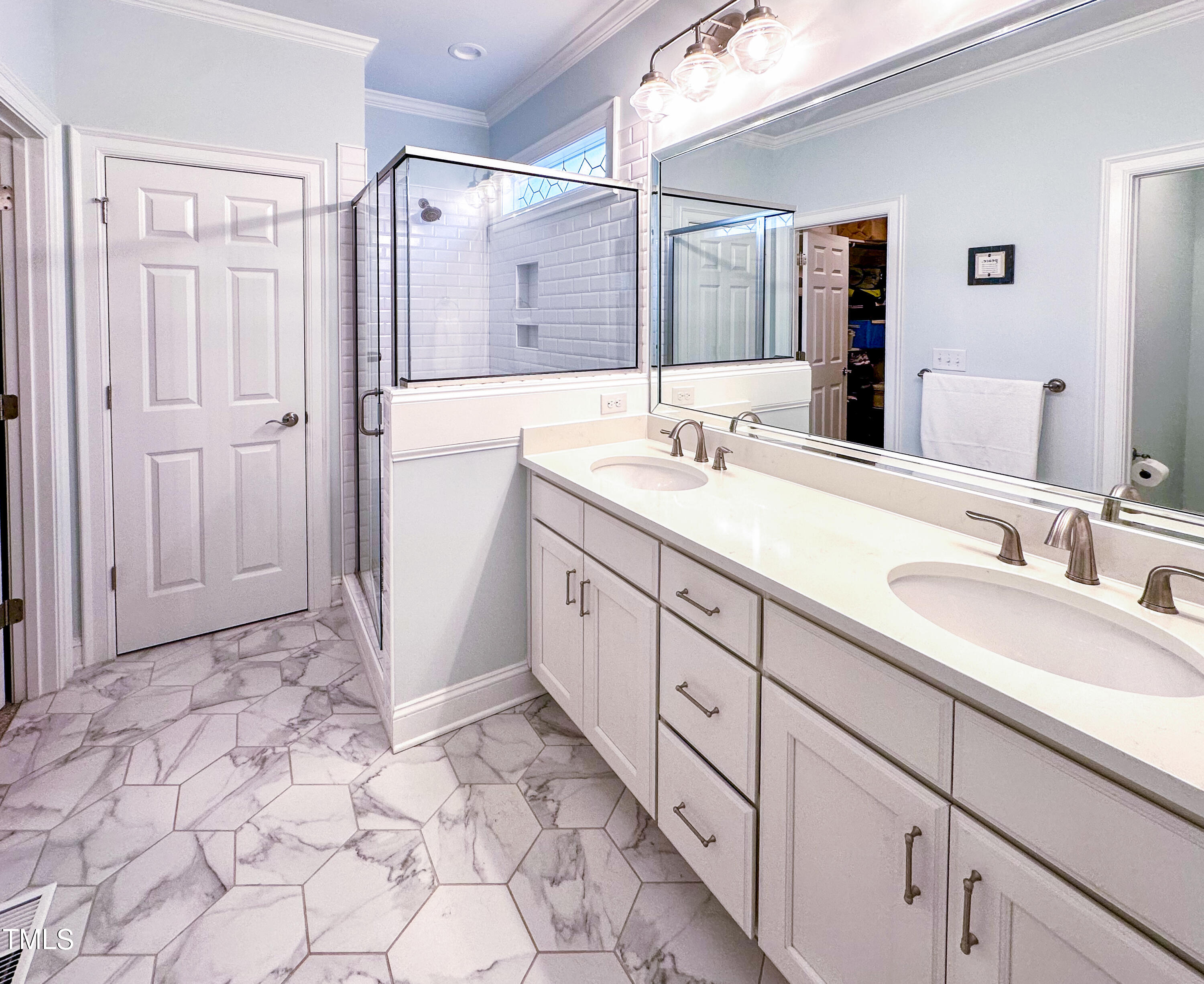 409 Eagle Court Henderson, NC 27536 - Photo 22 of 54 a spacious bathroom with a double vanity sink mirror and