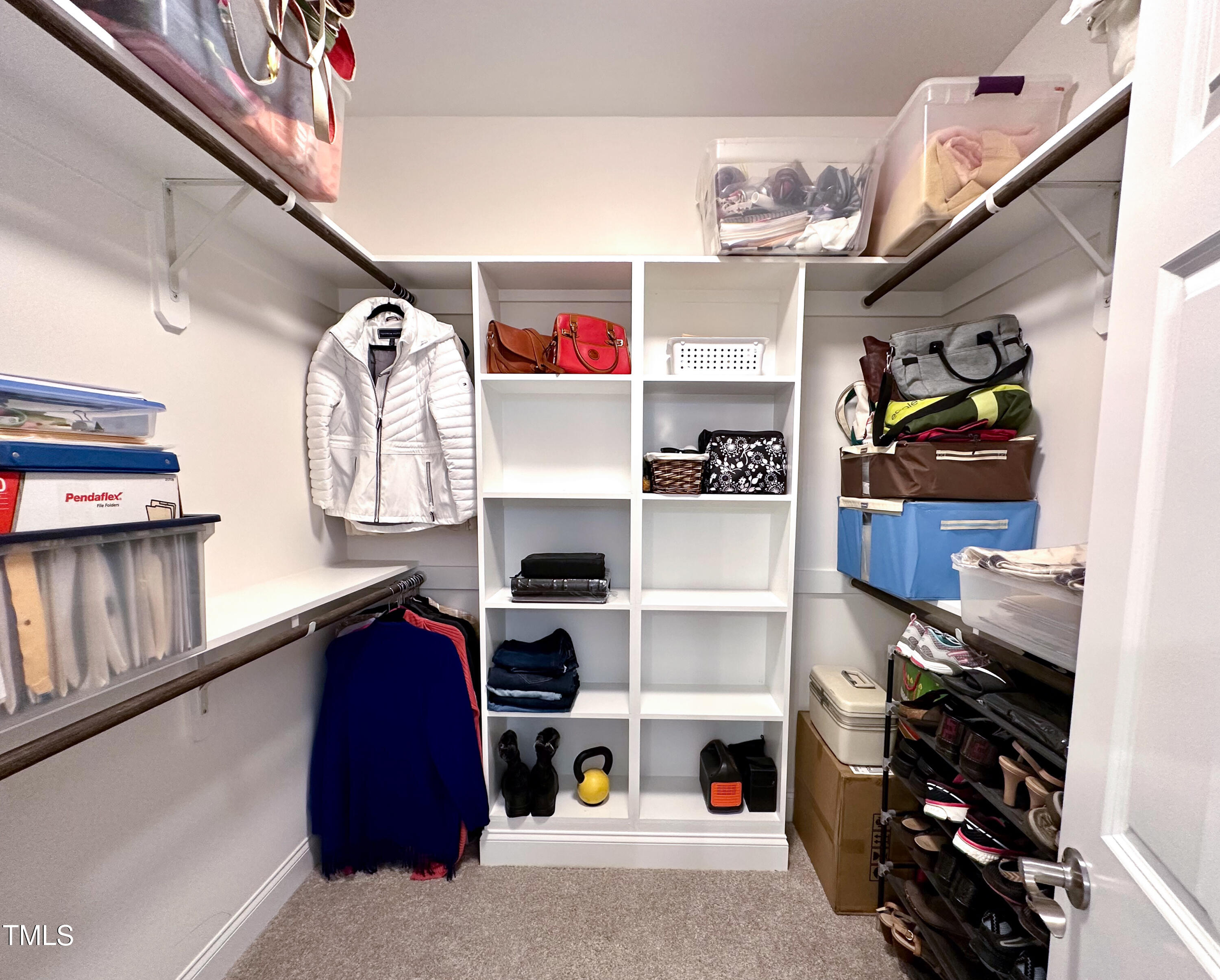 409 Eagle Court Henderson, NC 27536 - Photo 25 of 54 a view of walk in closet with clothes and shoes