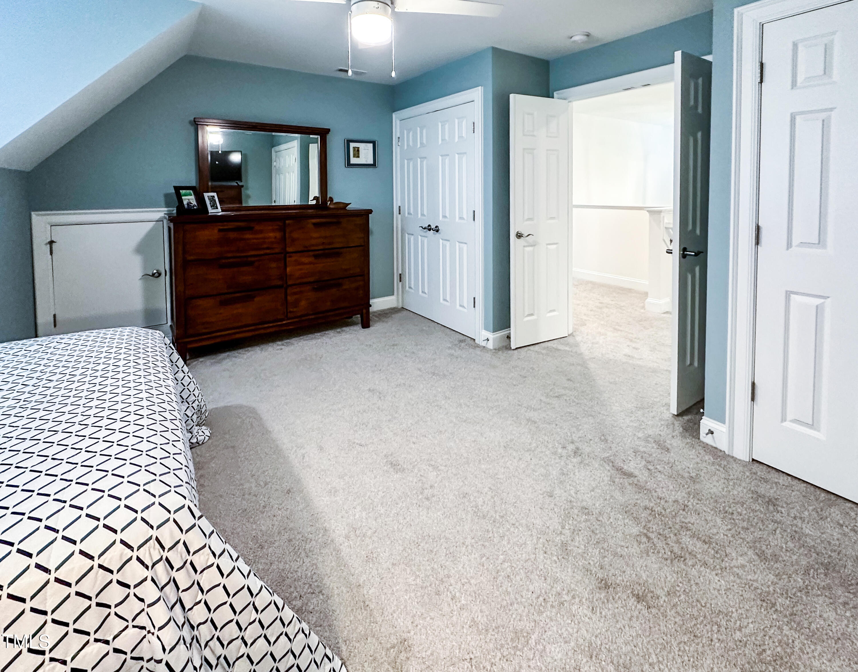 409 Eagle Court Henderson, NC 27536 - Photo 32 of 54 a room with a dresser and a window