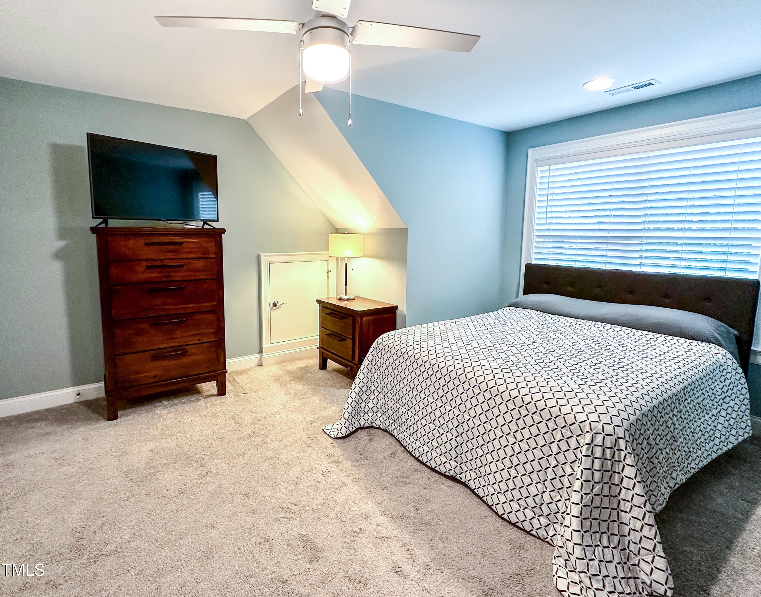 409 Eagle Court Henderson, NC 27536 - Photo 33 of 54 a bedroom with a bed and a television