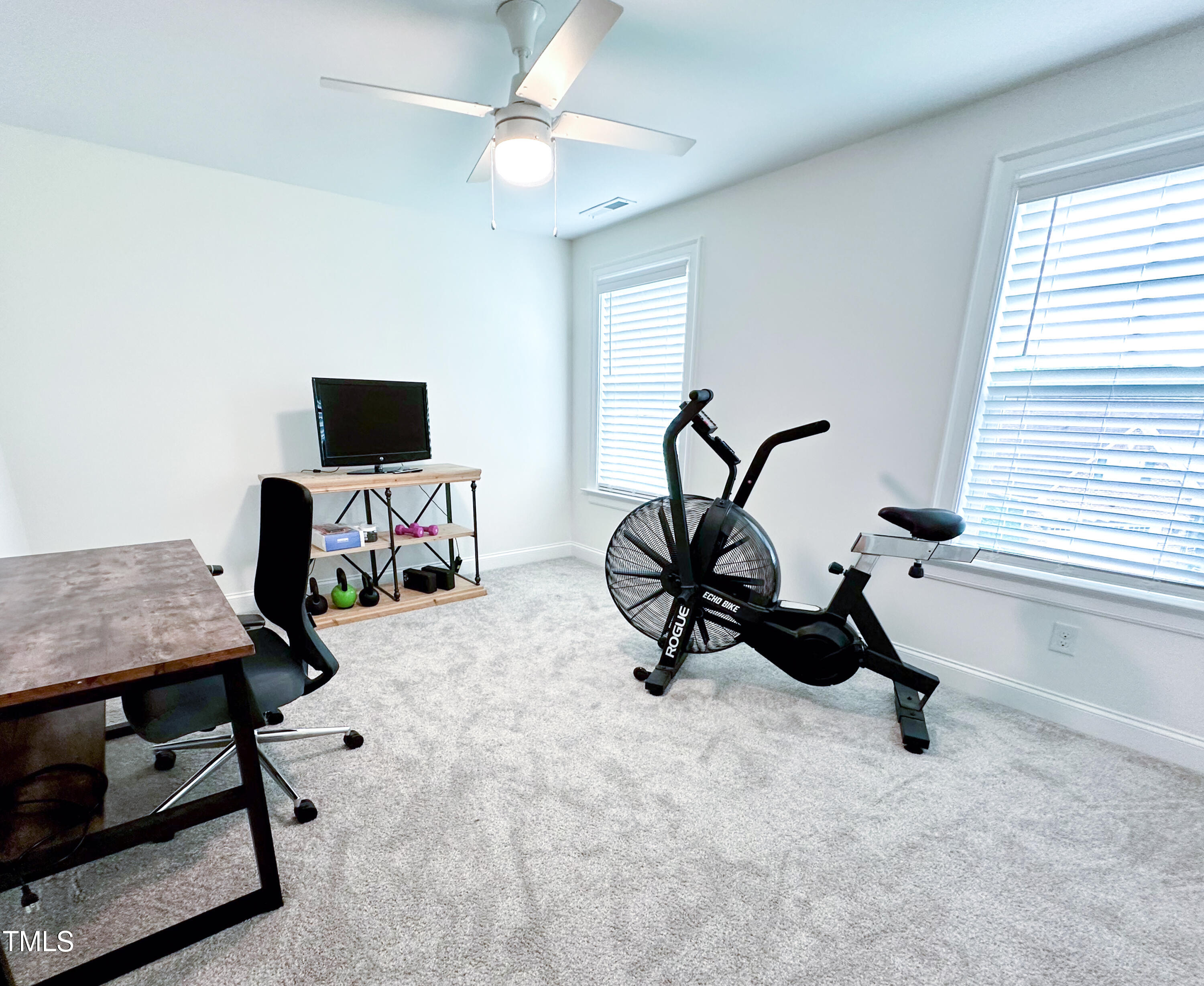 409 Eagle Court Henderson, NC 27536 - Photo 36 of 54 a view of a workspace with furniture and a window
