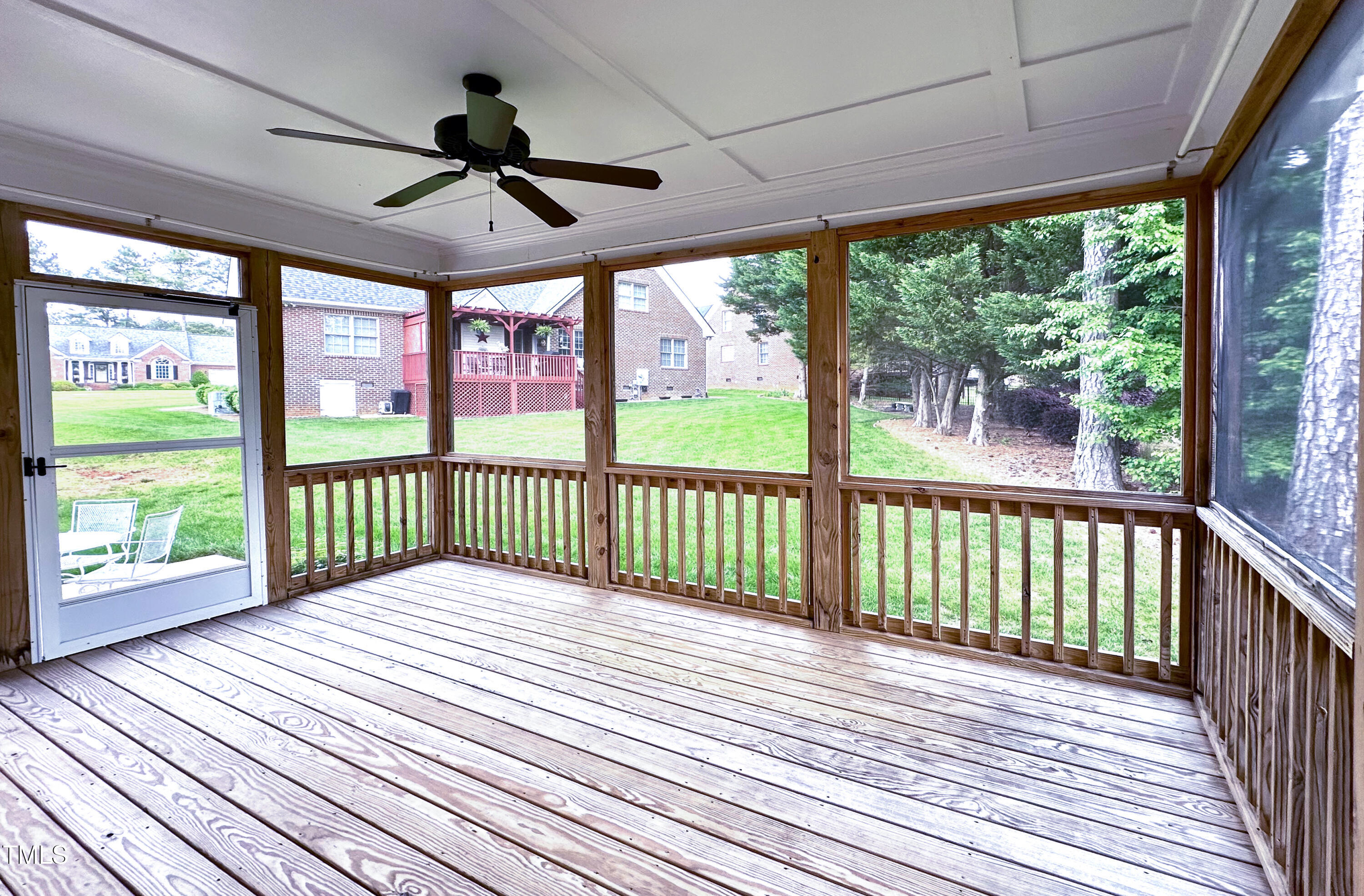 409 Eagle Court Henderson, NC 27536 - Photo 43 of 54 a view of a porch with wooden floor in front of a house