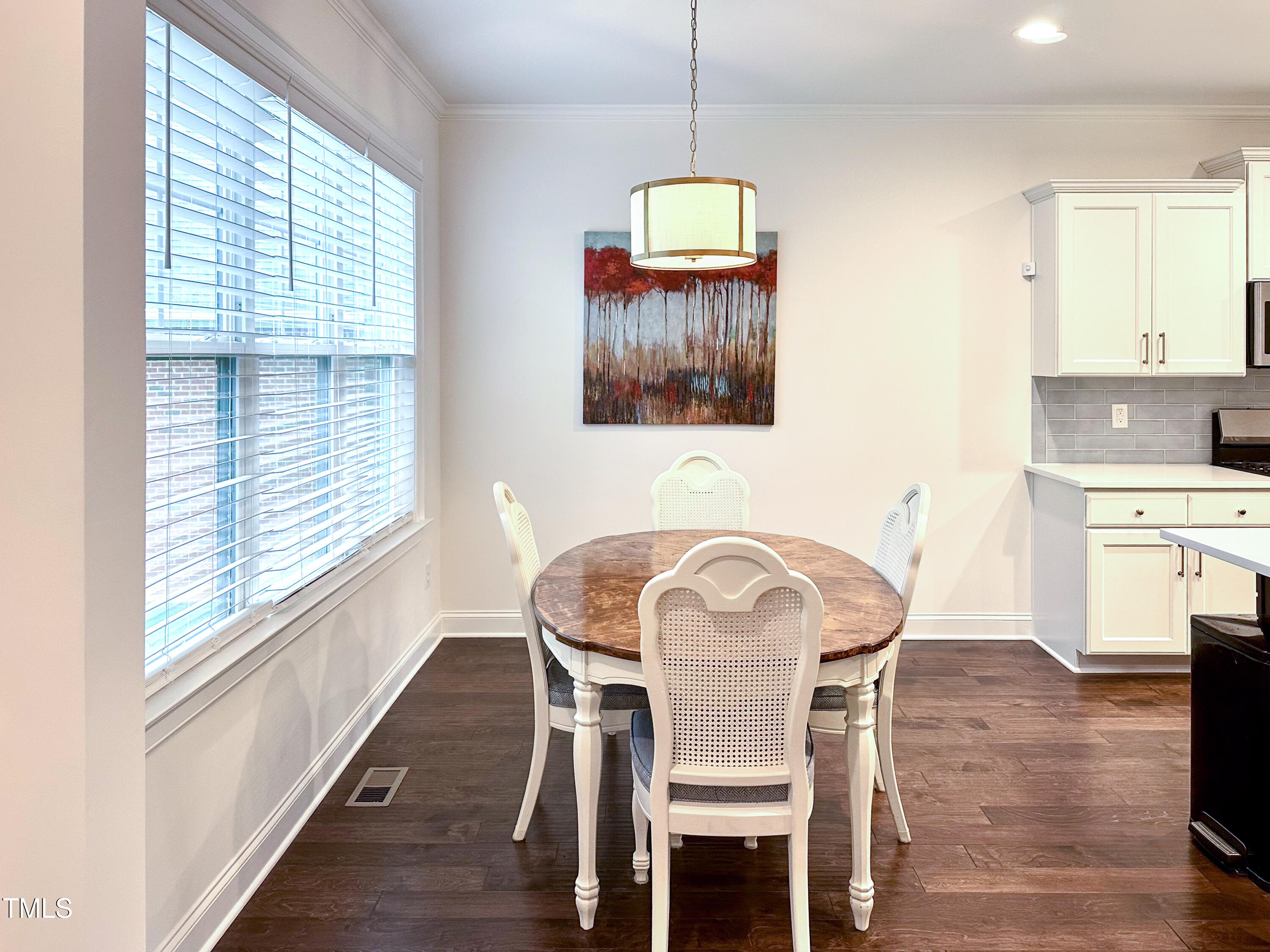 409 Eagle Court Henderson, NC 27536 - Photo 10 of 54 a view of a dining room with furniture window and wooden floor