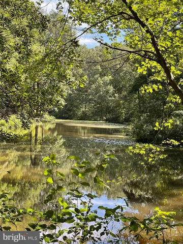 a sign that is sitting on the wooden wall