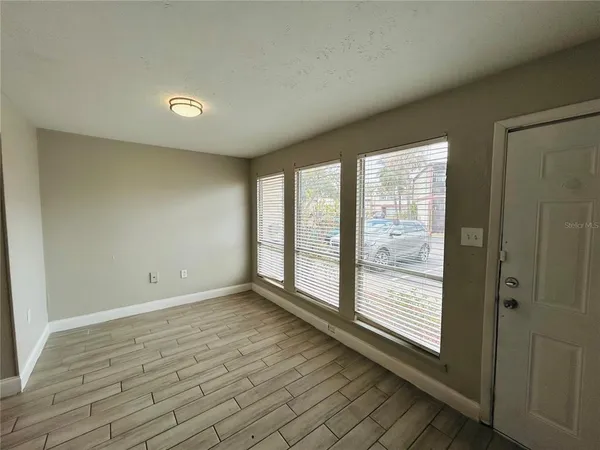 a view of an empty room with a window