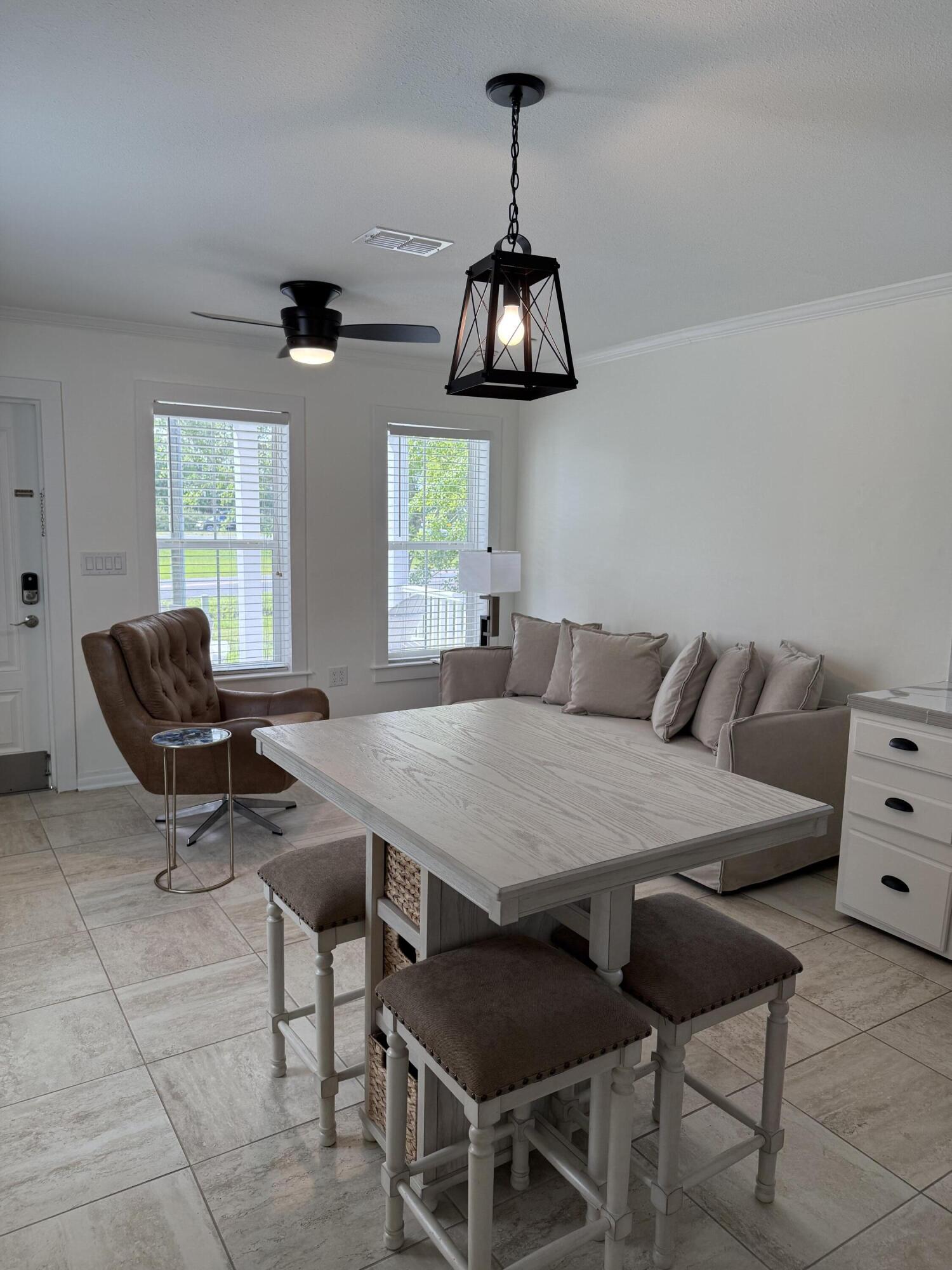 53 State Street Freeport, FL 32439 - Photo 4 of 11 a view of a dining room with furniture window and outside view