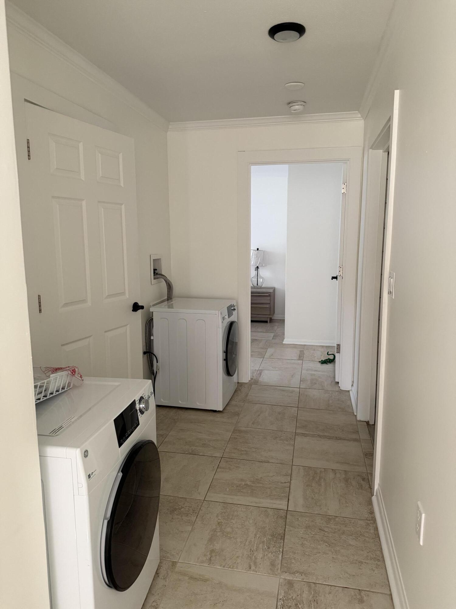 53 State Street Freeport, FL 32439 - Photo 6 of 11 a view of a storage & utility room with washer and dryer