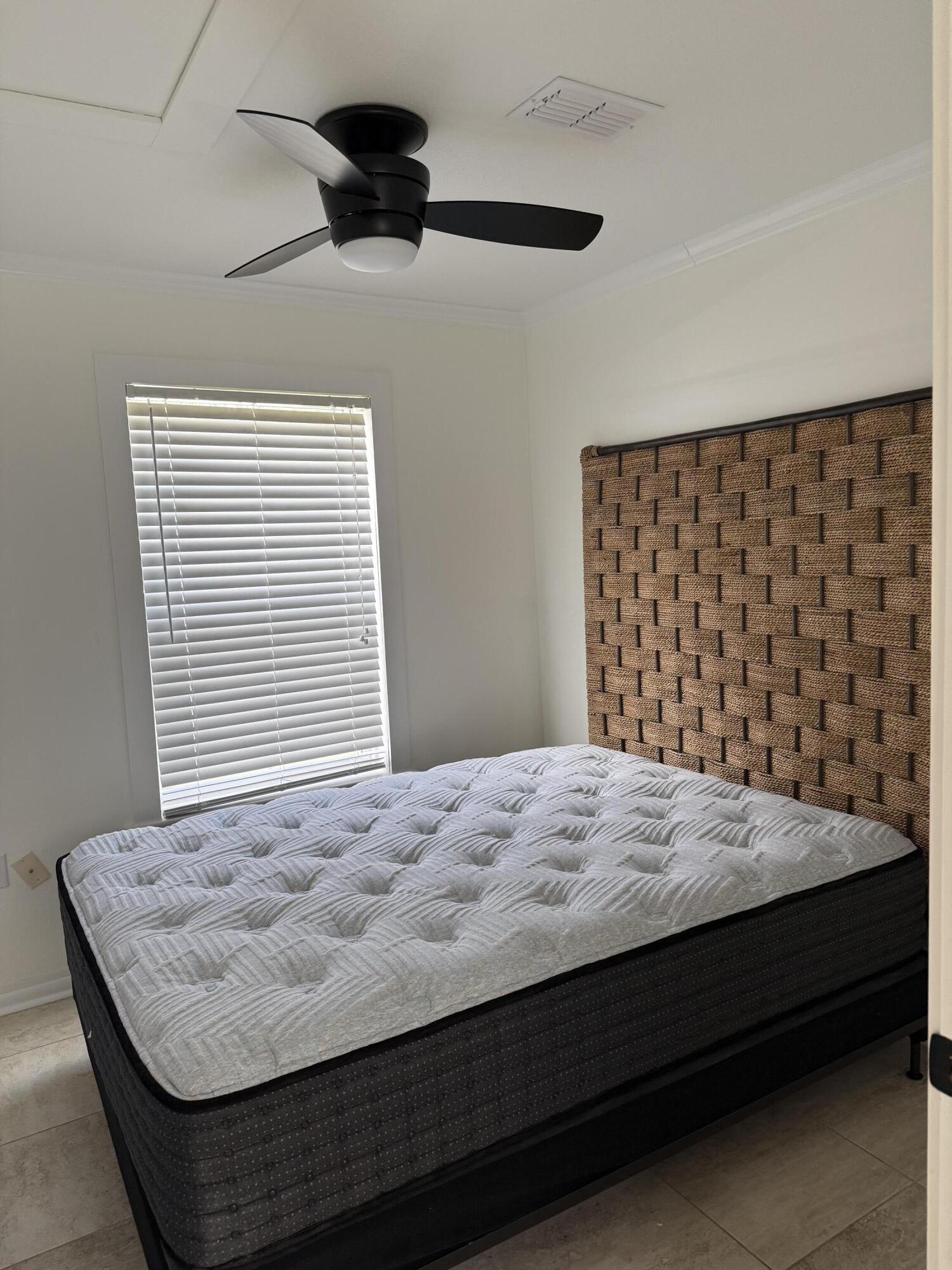 53 State Street Freeport, FL 32439 - Photo 8 of 11 a bedroom with a bed and a window