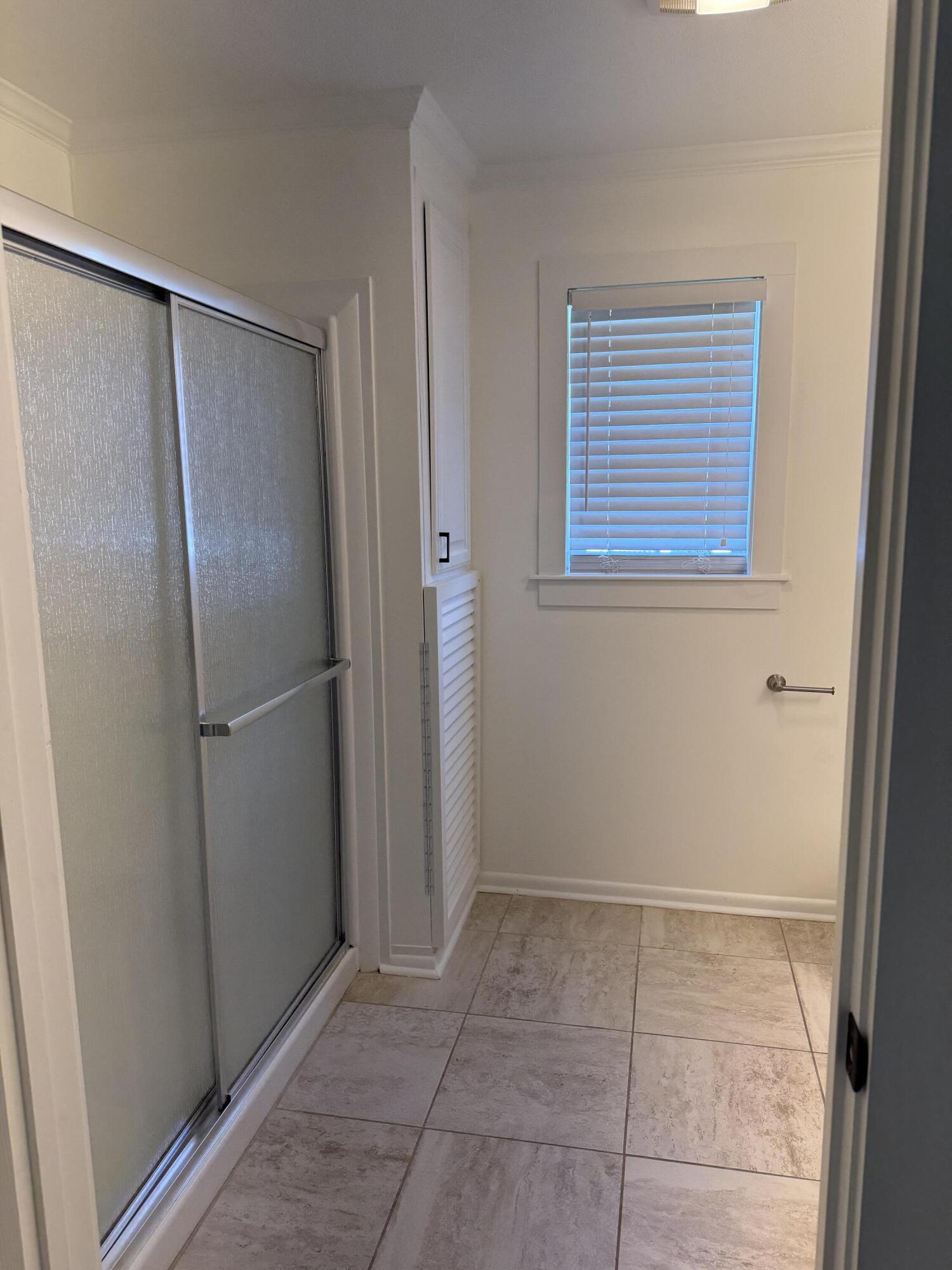 53 State Street Freeport, FL 32439 - Photo 9 of 11 a view of an empty room with closet and mirror