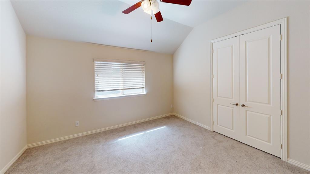 14712 Spitfire Trail Fort Worth, TX 76262 - Photo 17 of 25 Carpeted room with a vaulted ceiling, a window with horizontal blinds, and a ceiling fan