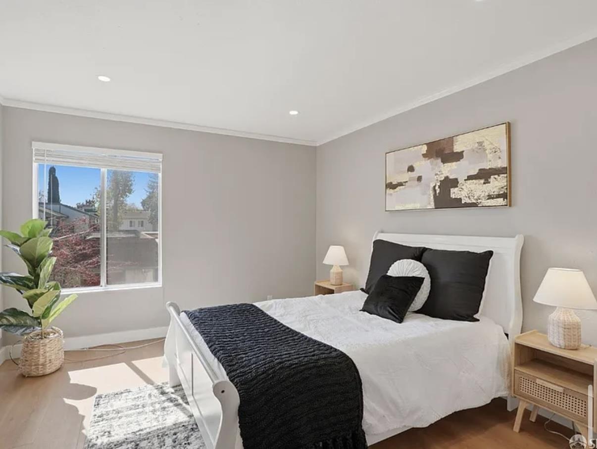 4081 Clayton Road, Unit 235 Concord, CA 94521 - Photo 12 of 19 a bedroom with bed and wooden floor
