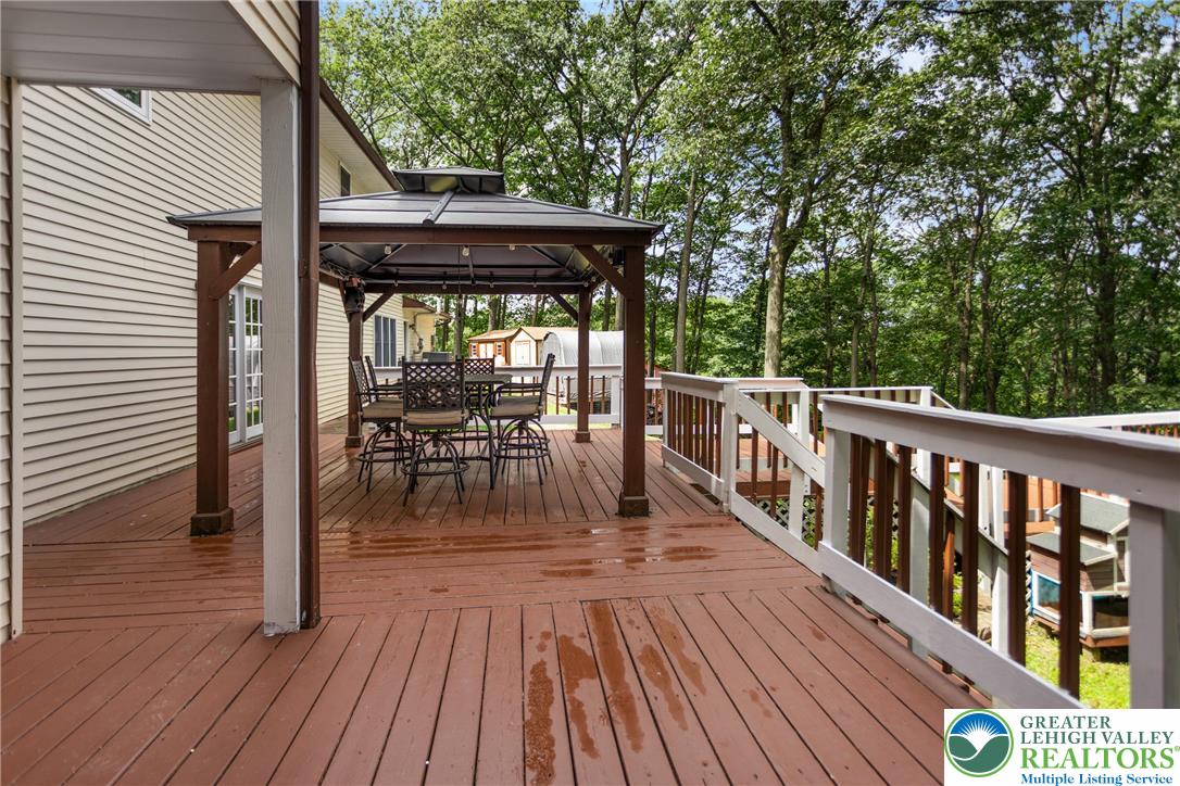 3571 Oak Ridge Drive Slatington, PA 18080 - Photo 36 of 43 a view of a chairs and table on the wooden deck