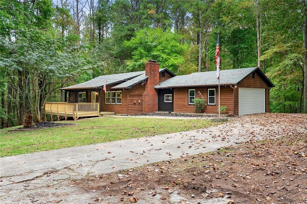 4310 Cochran Mill Road Fairburn, GA 30213 - Photo 1 of 1 a front view of a house with a garden