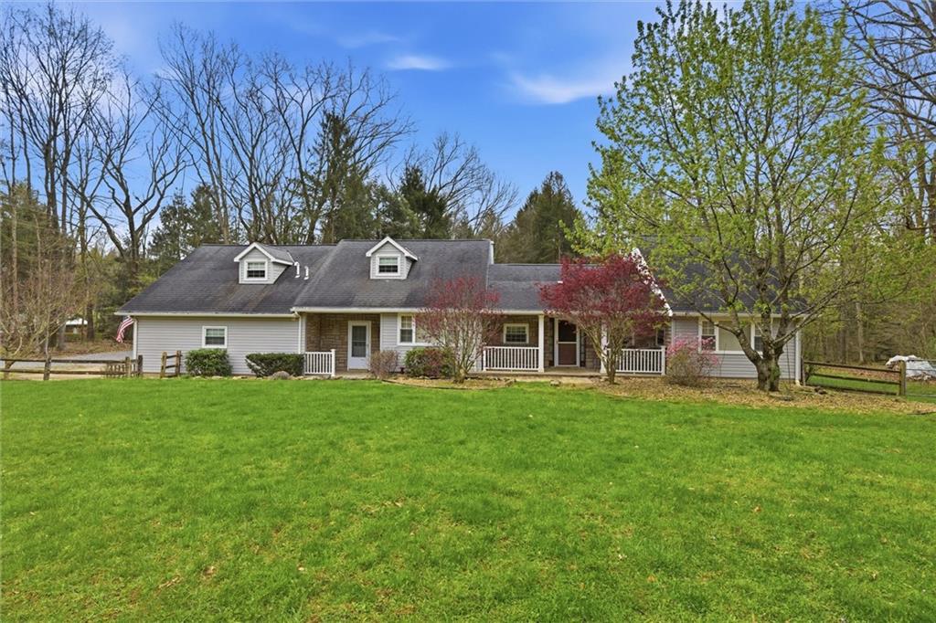 7092 Mercer Road Polk, PA 16342 - Photo 33 of 50 a front view of a house with a garden
