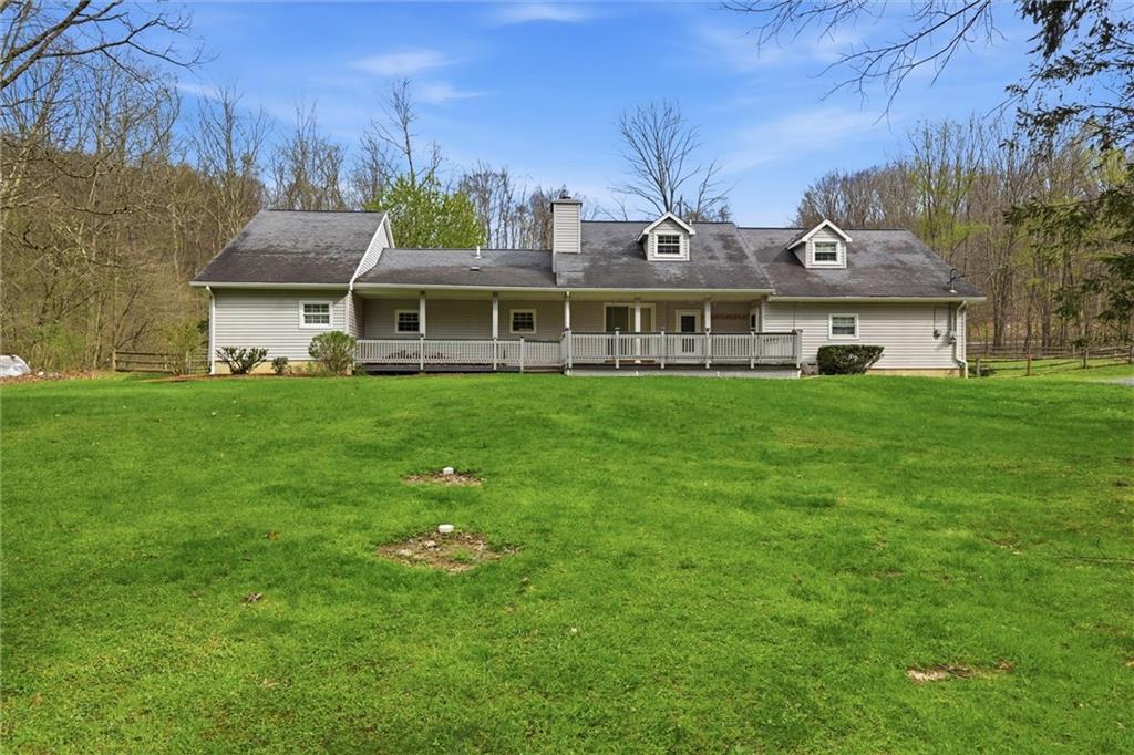7092 Mercer Road Polk, PA 16342 - Photo 34 of 50 a front view of a house with a garden