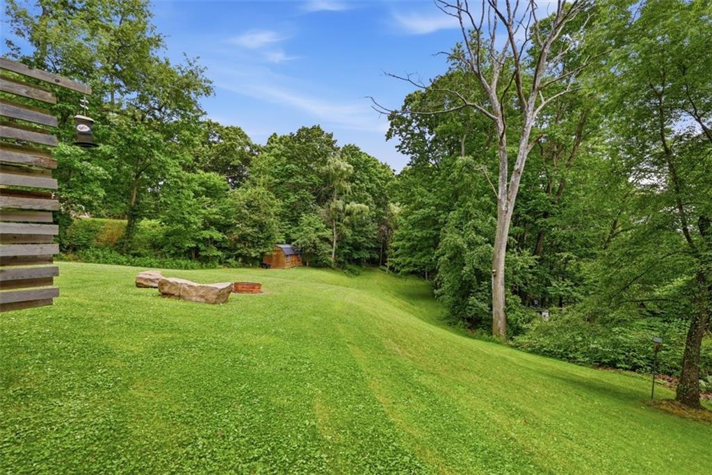 5380 Hardt Road Gibsonia, PA 15044 - Photo 43 of 49 The yard extends all the way out and into the woods. Notice the shed/chicken coop tucked away in the trees.