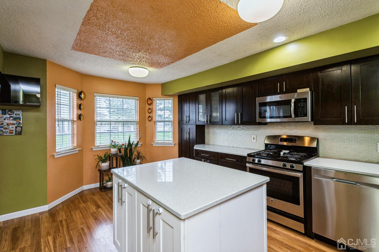 409 Draco Road Piscataway, NJ 08854 - Photo 12 of 28 a kitchen that has a sink and a stove top oven